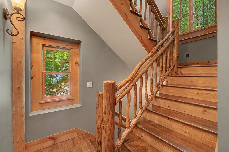 Staircase with a hand-rail of natural branches