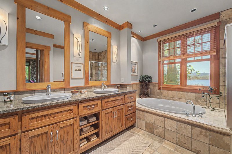 Primary bath with double vanity and soaking tub under the window