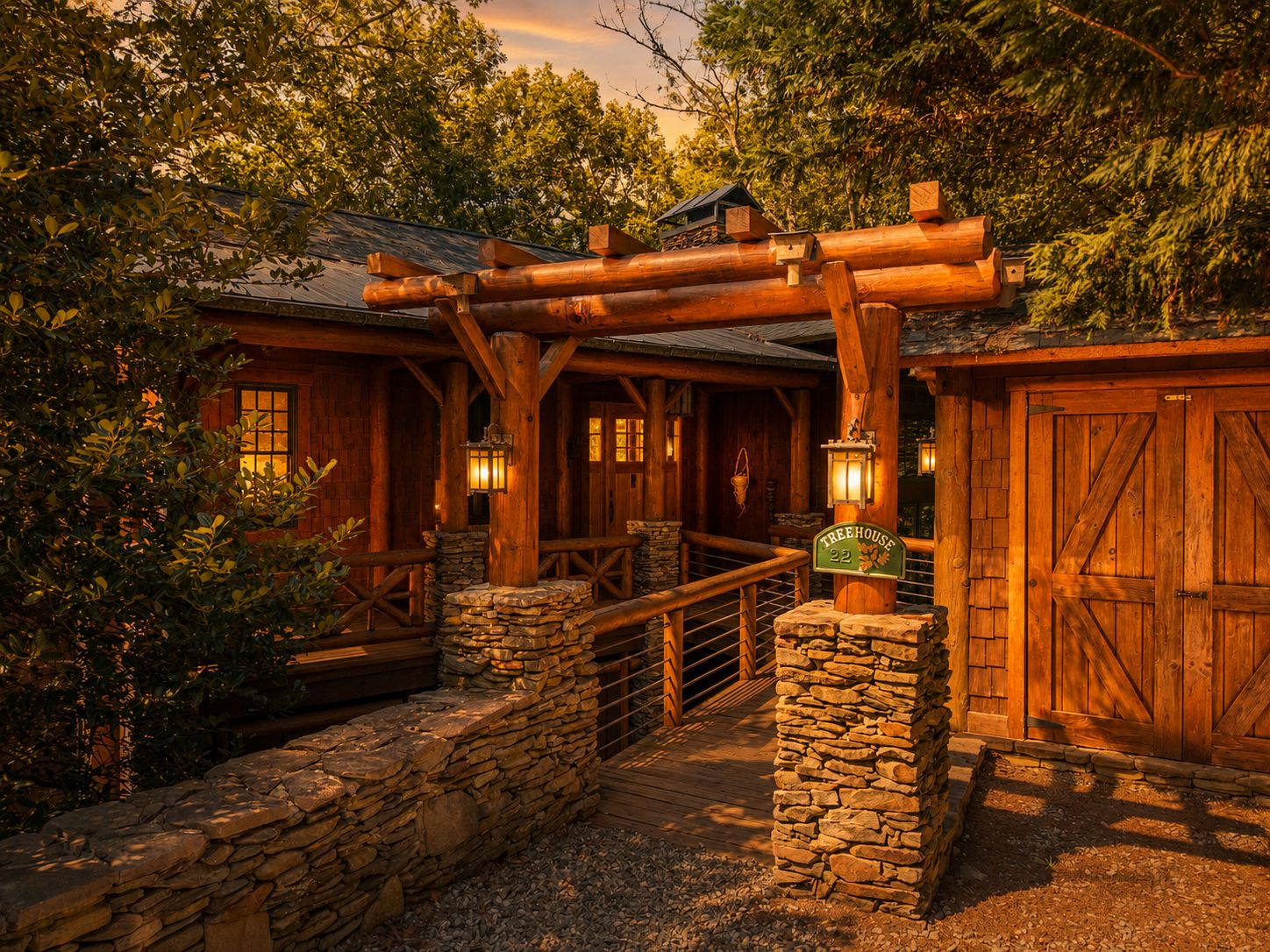 Log pergola and stacked-stone walls at the front entry at dusk, with lanterns lit