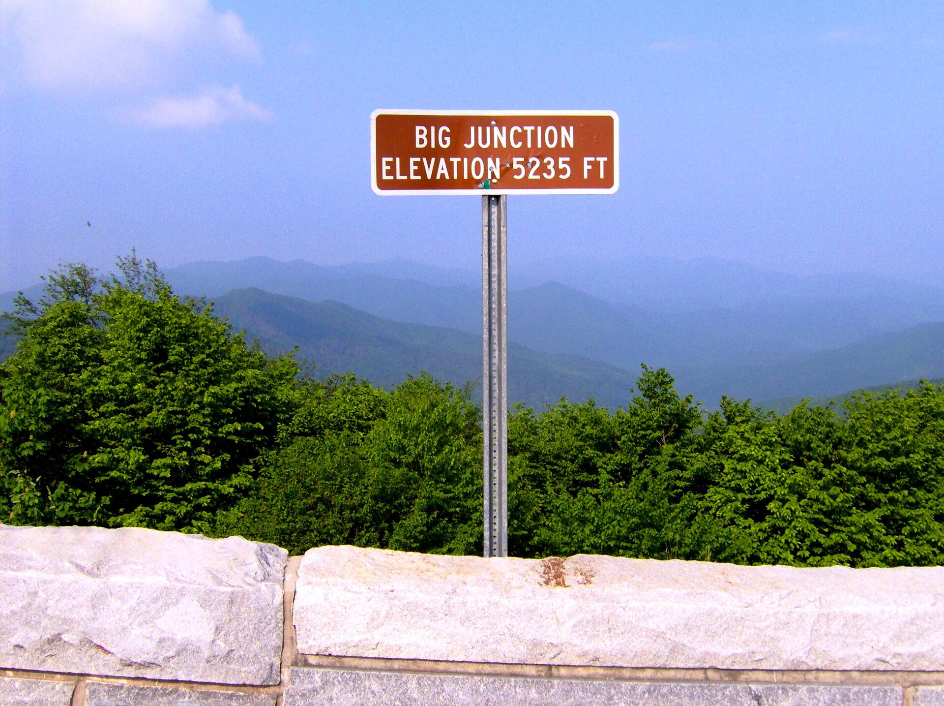 Big Junction Overlook sign, elevation 5,235 feet, over layered ridges